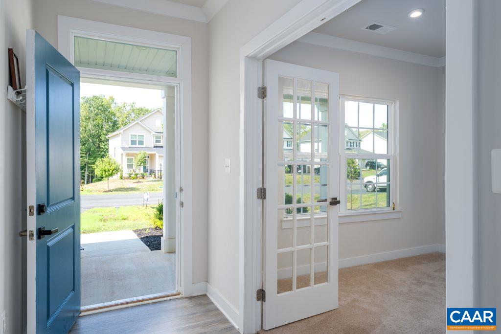 117 Island Hill Road Palmyra, VA 22963 - Photo 6 of 34 a view of an entryway with wooden floor and a livingroom