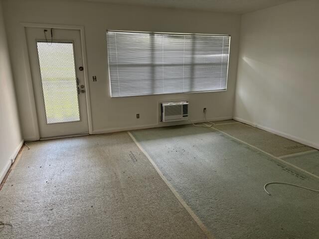 273 Suffolk F Boca Raton, FL 33434 - Photo 2 of 9 an empty room with a window