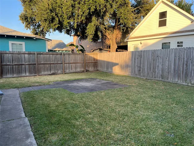 a view of a house with a wooden deck