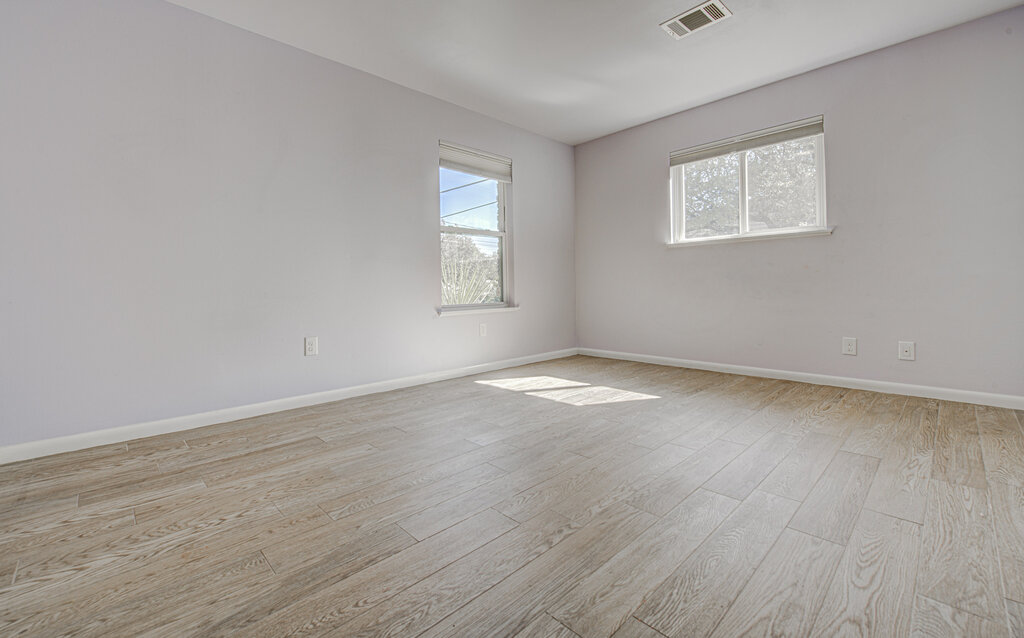 2400 Spring Creek Drive Austin, TX 78704 - Photo 12 of 38 Spare room with light wood-style floors