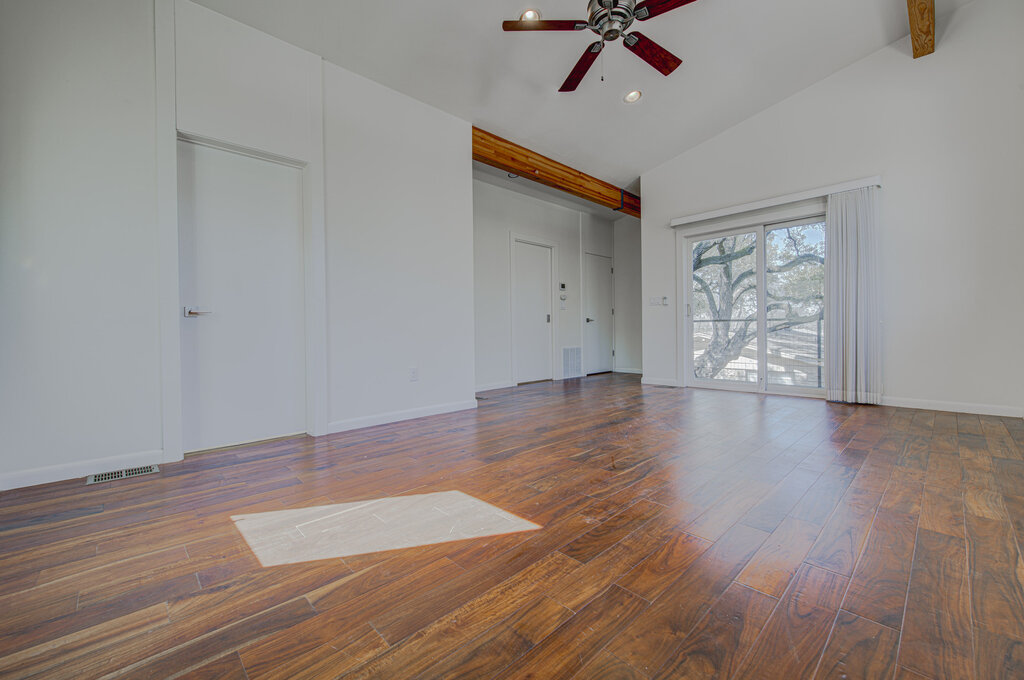 2400 Spring Creek Drive Austin, TX 78704 - Photo 19 of 38 Unfurnished bedroom featuring dark wood-type flooring, recessed lighting, ceiling fan, lofted ceiling, and access to exterior