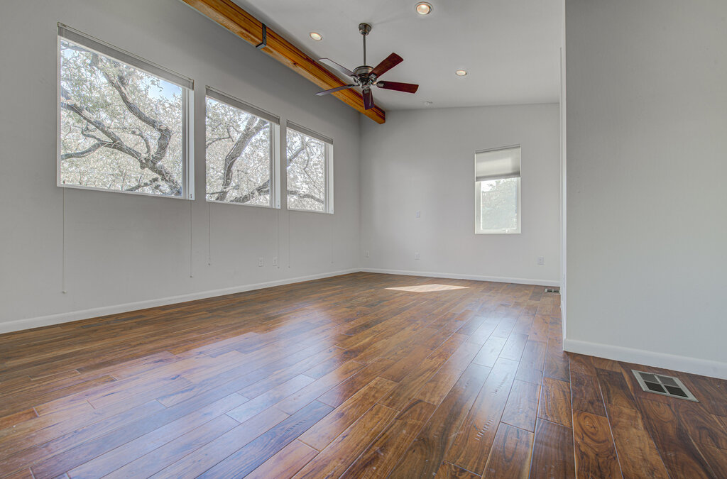 2400 Spring Creek Drive Austin, TX 78704 - Photo 20 of 38 Spare room with dark wood-style floors, a ceiling fan, and recessed lighting