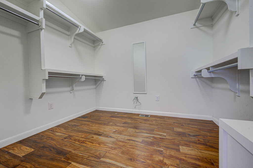 2400 Spring Creek Drive Austin, TX 78704 - Photo 21 of 38 Walk in closet featuring dark wood finished floors