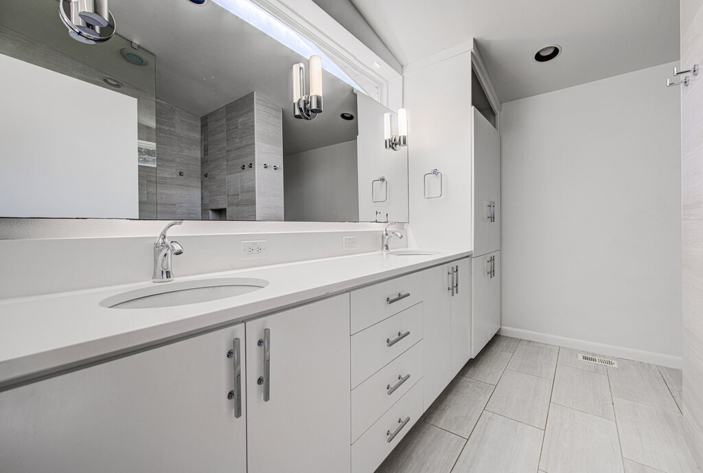 2400 Spring Creek Drive Austin, TX 78704 - Photo 22 of 38 Full bathroom with double vanity and a shower