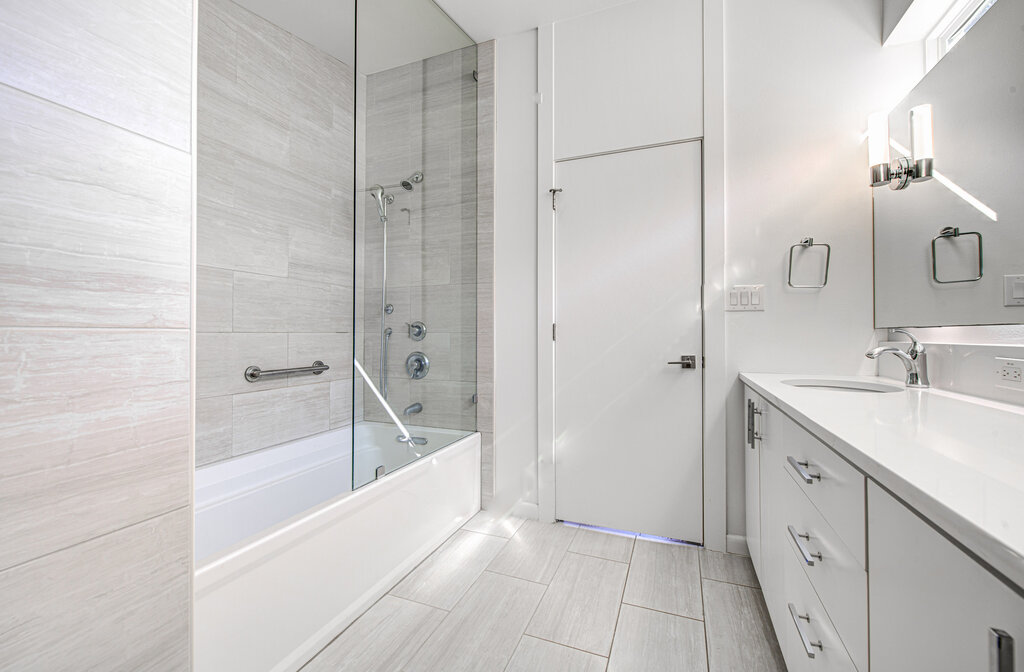 2400 Spring Creek Drive Austin, TX 78704 - Photo 23 of 38 Bathroom with vanity and shower / washtub combination