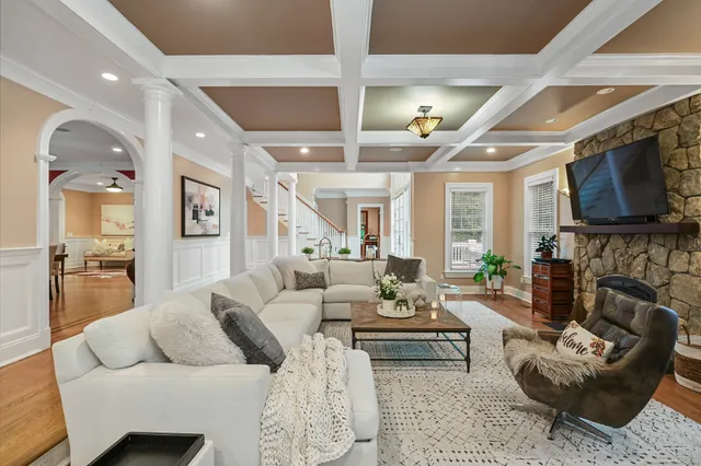 a living room with fireplace furniture and a flat screen tv