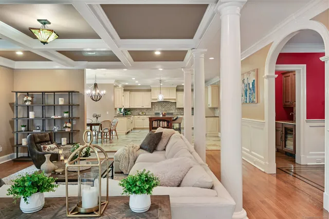 a living room with furniture and flowers