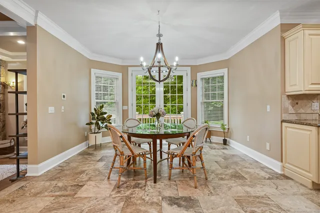 a view of a dining room with furniture window and outside view