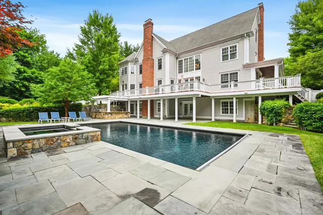 a view of a swimming pool with lounge chair