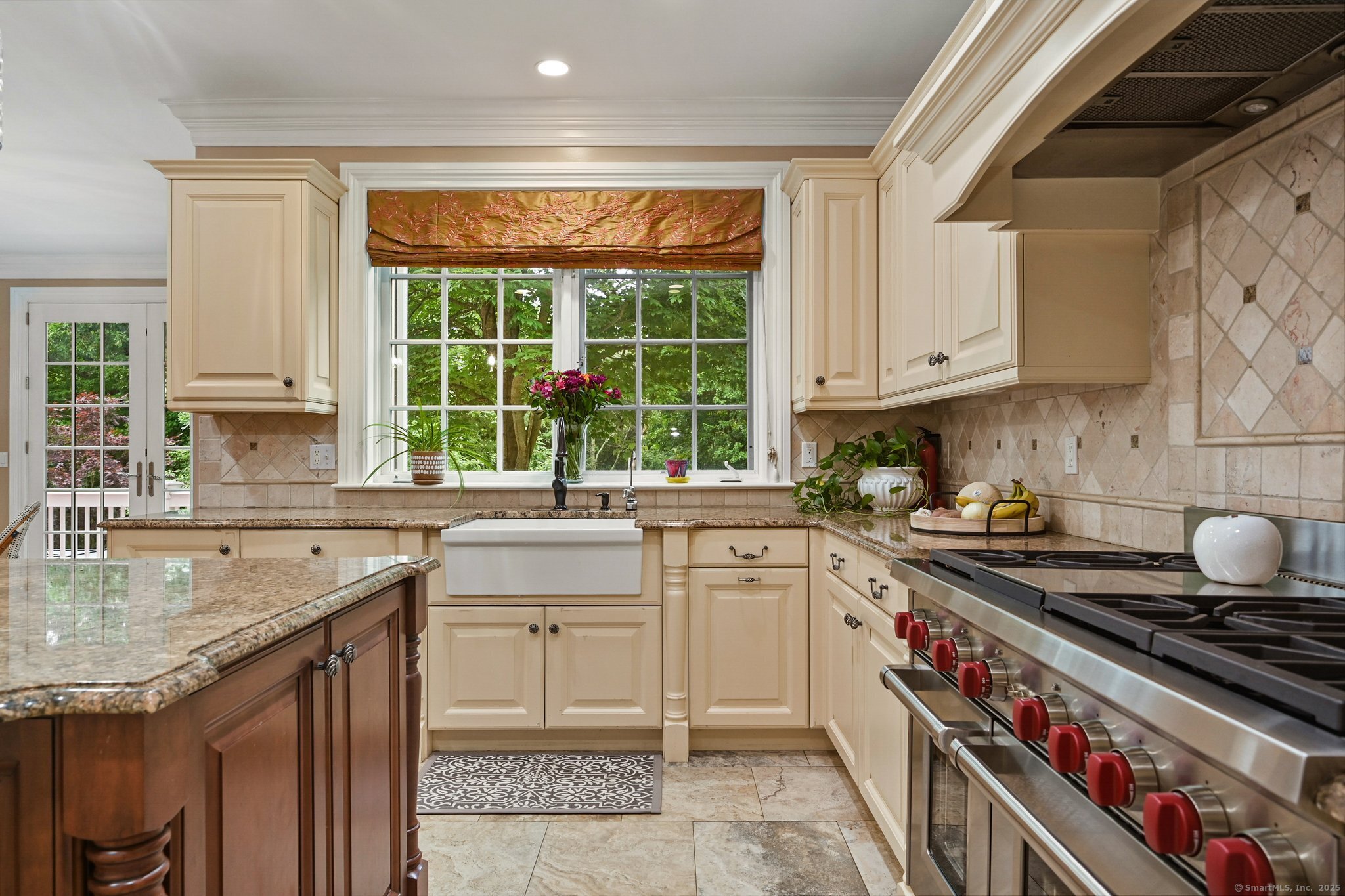 87 Buckingham Ridge Road Wilton, CT 06897 - Photo 21 of 39 a kitchen with stainless steel appliances granite countertop a sink stove and cabinets