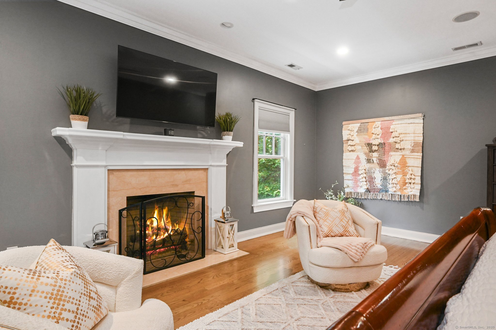 87 Buckingham Ridge Road Wilton, CT 06897 - Photo 29 of 39 a living room with furniture and a fireplace