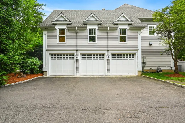 a view of a house with a backyard porch and sitting area