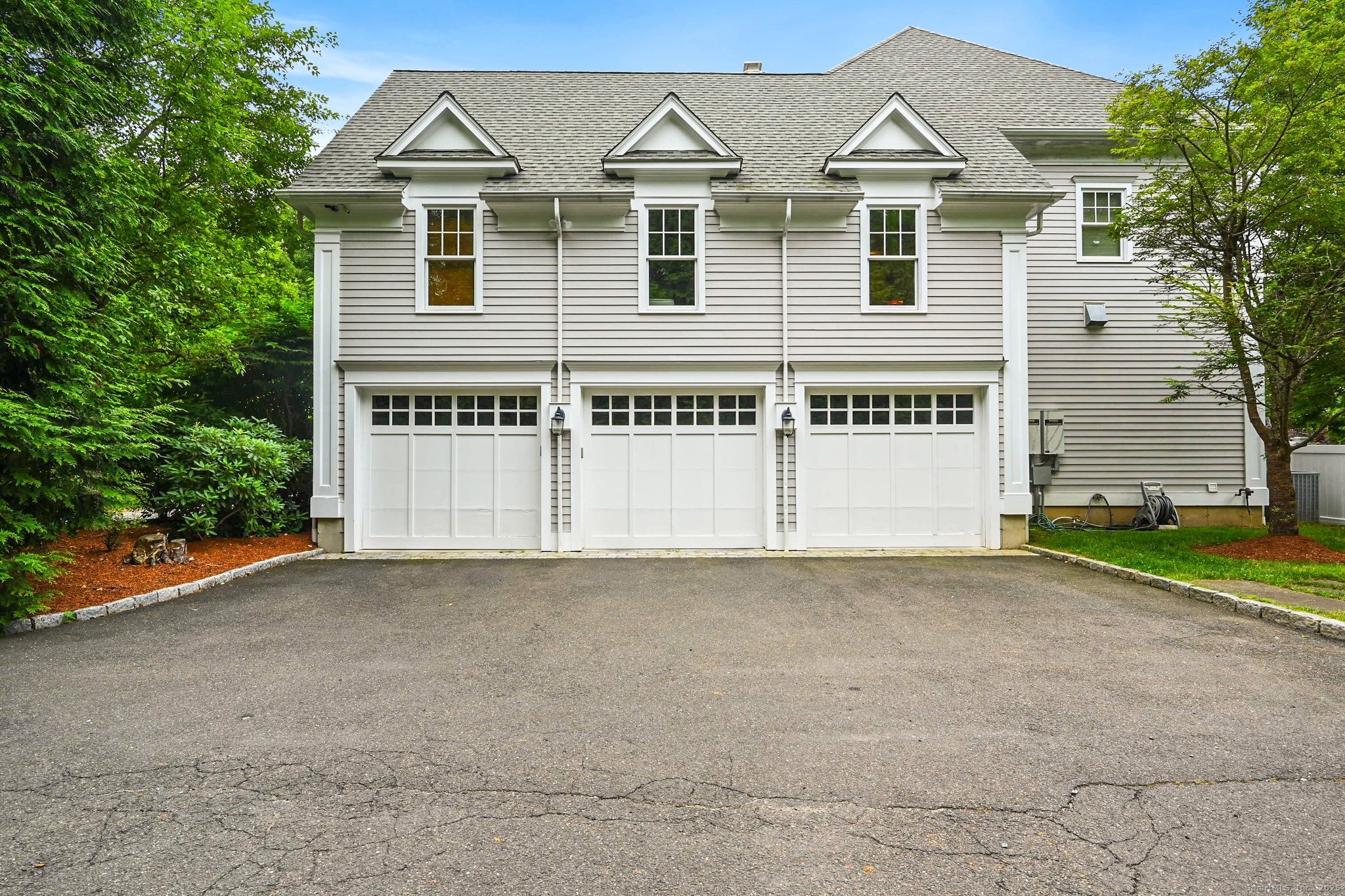 87 Buckingham Ridge Road Wilton, CT 06897 - Photo 35 of 39 a view of a large white apartments with large windows