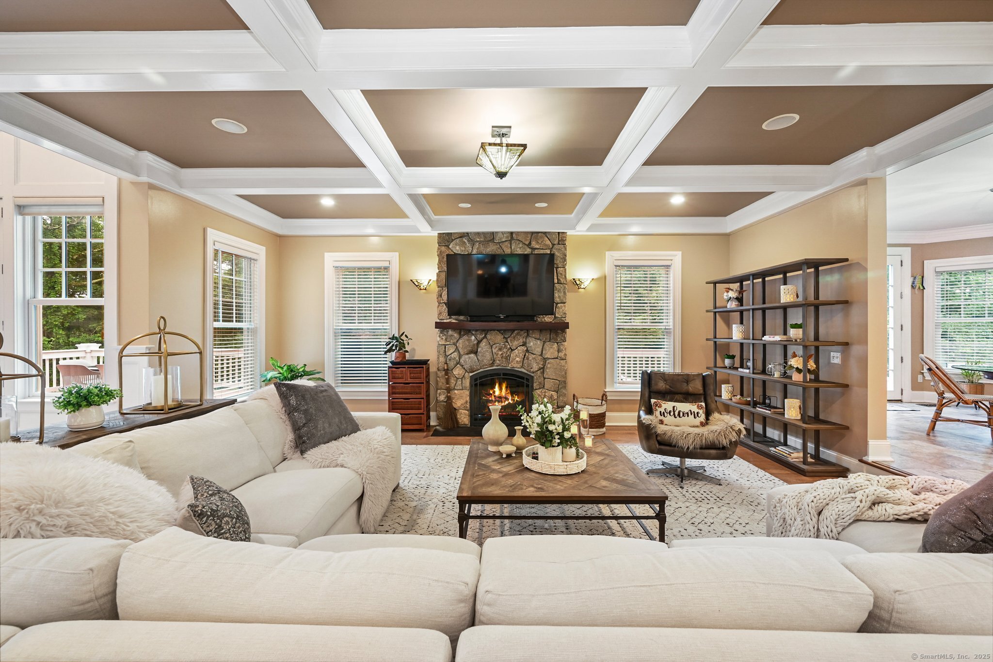 87 Buckingham Ridge Road Wilton, CT 06897 - Photo 5 of 39 a living room with fireplace furniture and a large window