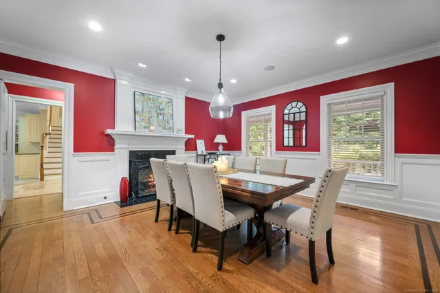 a view of a dining room with furniture window and wooden floor