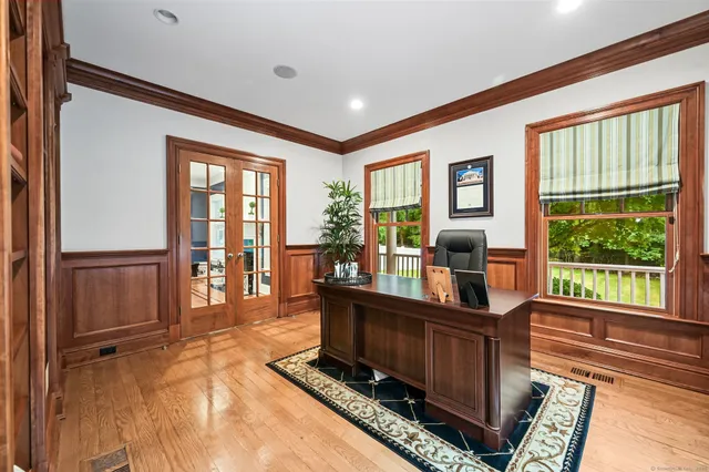 a view of workspace with furniture and windows