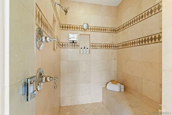 a view of a patio with a table and chairs