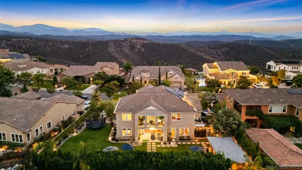 an aerial view of residential houses with outdoor space