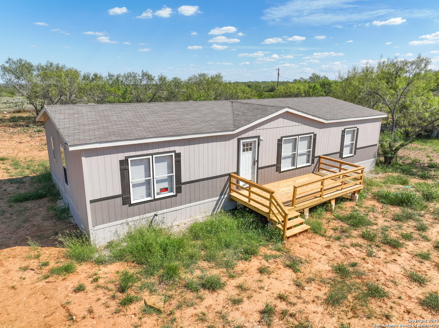 a aerial view of a house with a yard