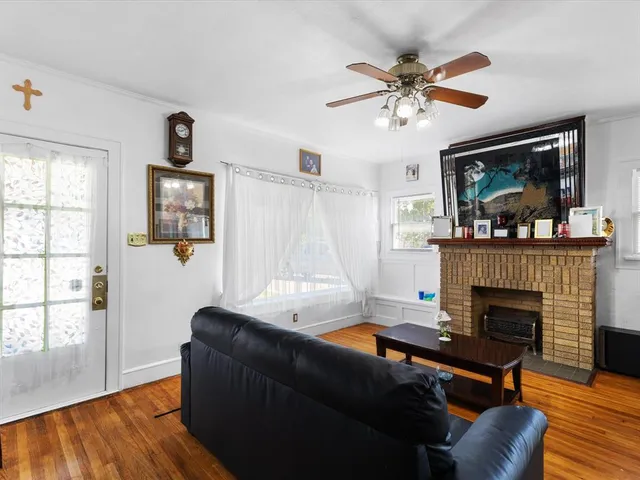 a living room with furniture and a fireplace