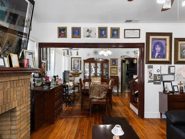 a living room filled with furniture and a floor to ceiling window