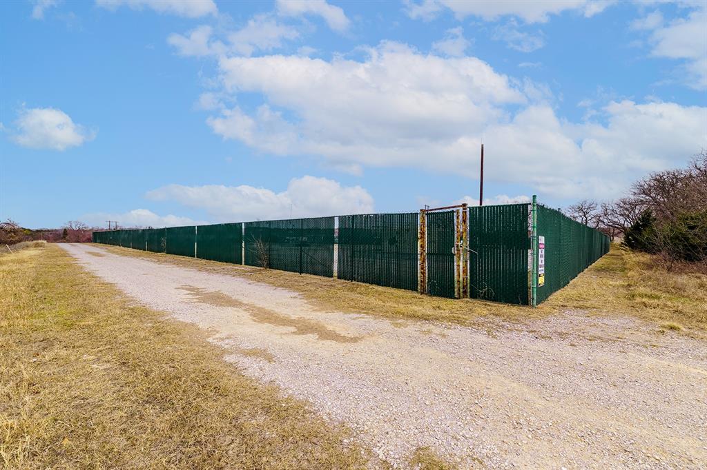 700 South Deer Park Road Decatur, TX 76234 - Photo 23 of 40 View of dirt / gravel road with a gate