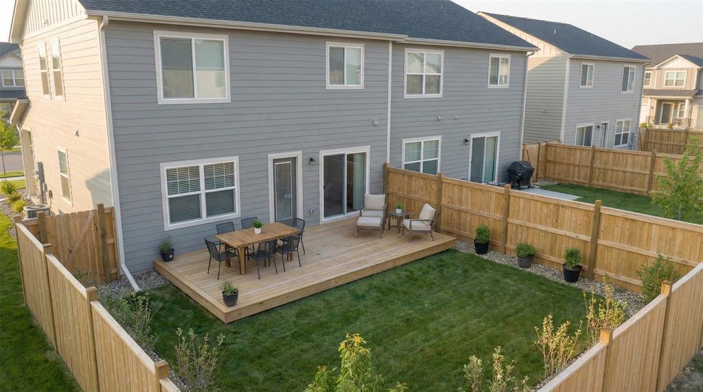700 South Deer Park Road Decatur, TX 76234 - Photo 27 of 40 Back of property with a fenced backyard, outdoor dining area, a residential view, and a wooden deck