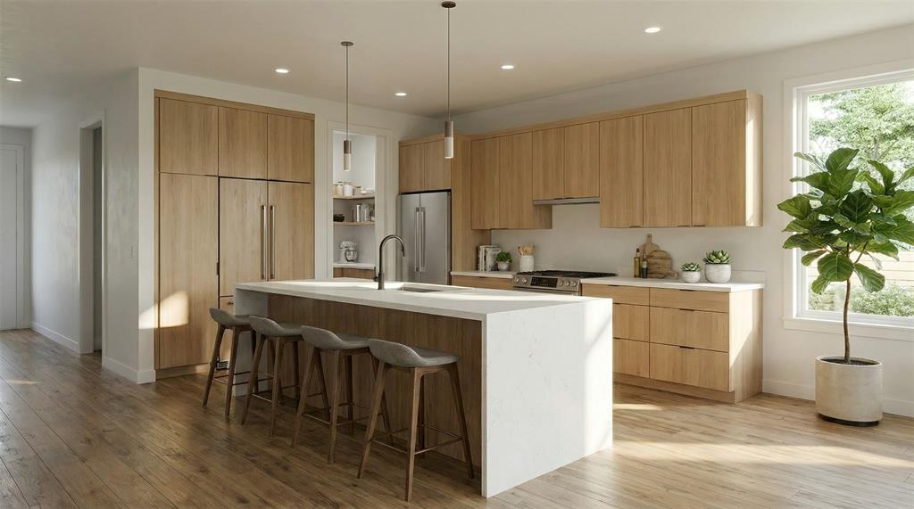 700 South Deer Park Road Decatur, TX 76234 - Photo 28 of 40 Kitchen featuring plenty of natural light, modern cabinets, a kitchen bar, hanging light fixtures, and recessed lighting