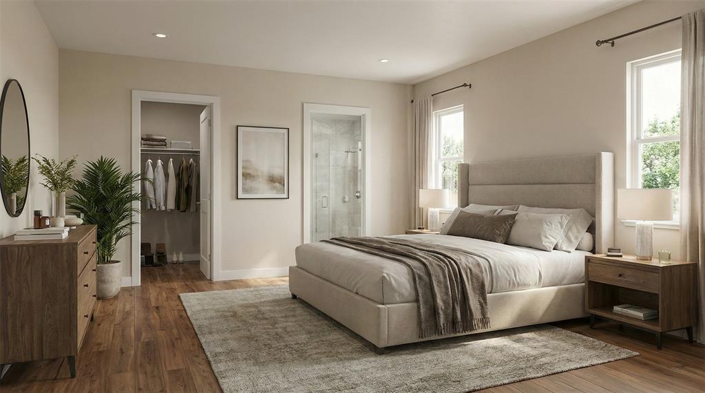 700 South Deer Park Road Decatur, TX 76234 - Photo 36 of 40 Bedroom with a spacious closet, dark wood-style flooring, and connected bathroom