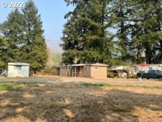 37635 Row River Road Dorena, OR 97434 - Photo 5 of 8 a view of a house with a yard