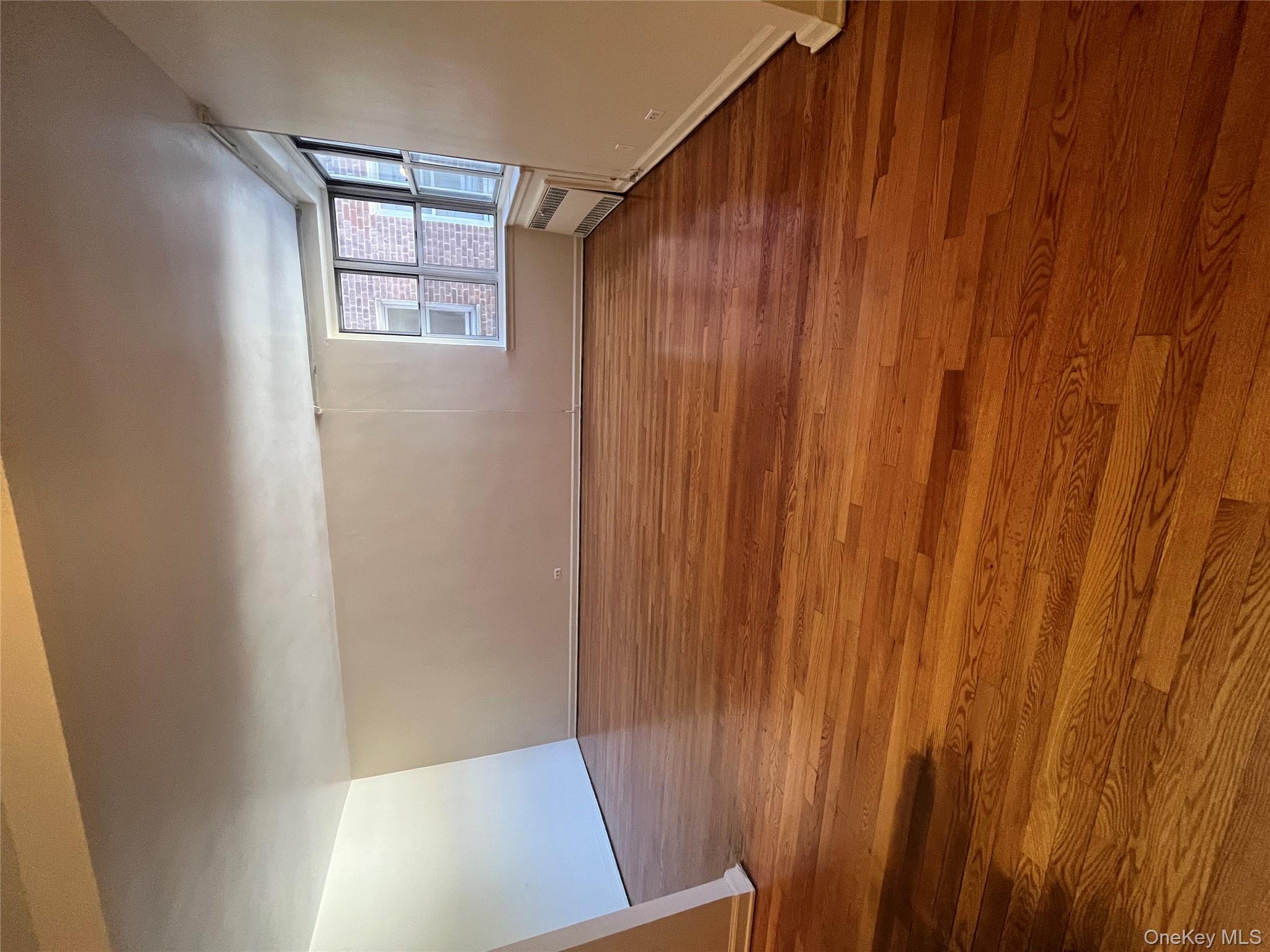 325 East 201st Street, Unit 4D Bronx, NY 10458 - Photo 15 of 22 Spare room featuring wood finished floors