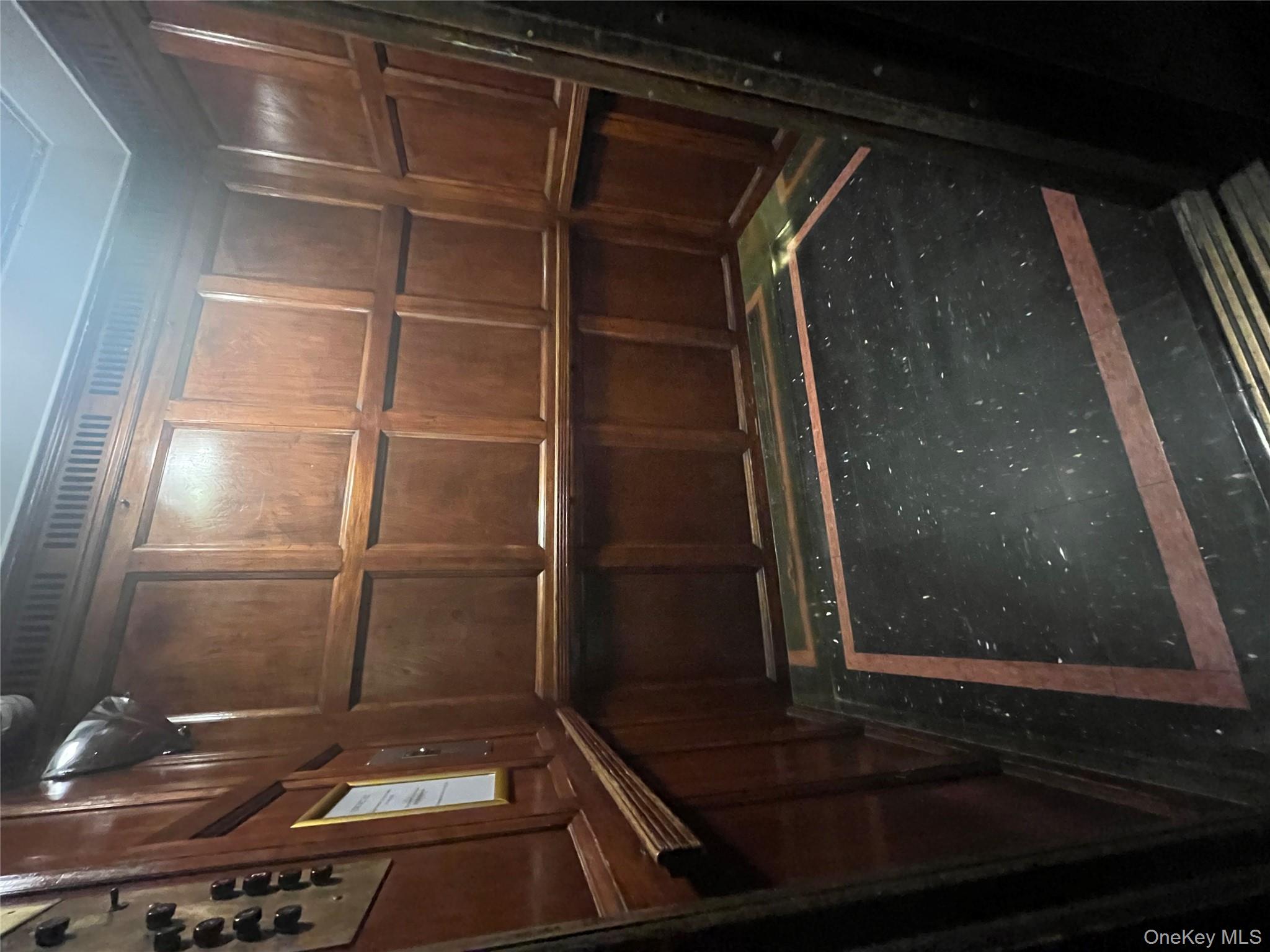 325 East 201st Street, Unit 4D Bronx, NY 10458 - Photo 3 of 22 Elevator with wooden walls