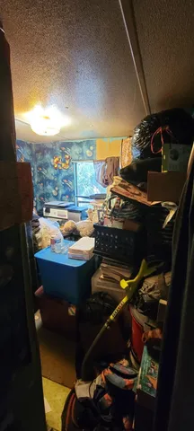 a room with lots of different colored cloths