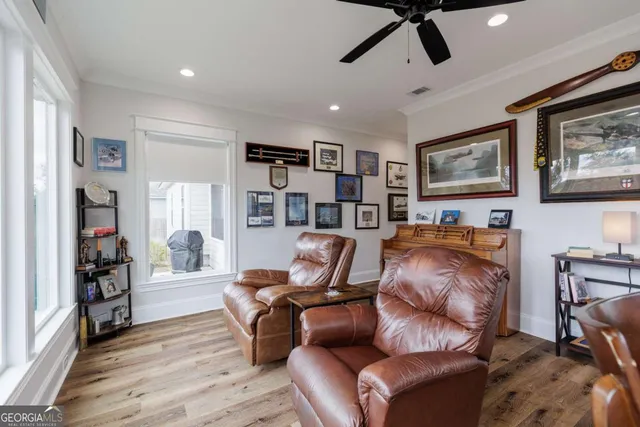 a living room with furniture and a book shelf