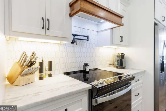 a kitchen with a stove and a sink