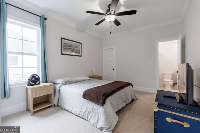 a bedroom with a bed furniture and a window