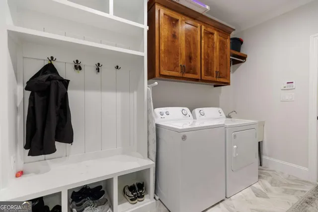 a utility room with dryer and washer