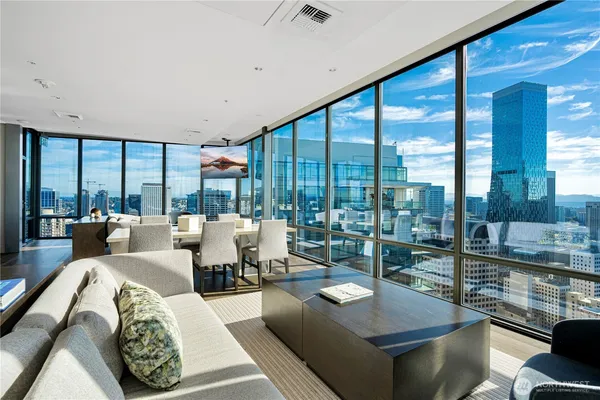 a living room with furniture and a large window