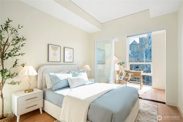 a bedroom with a bed and a window
