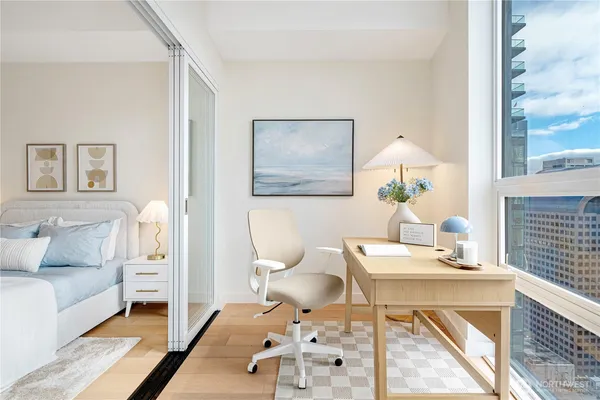 a living room with furniture a table and chair