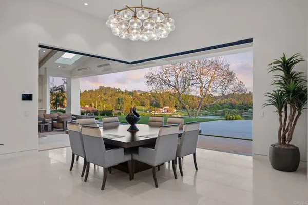 a view of a dining room with furniture window and outside view