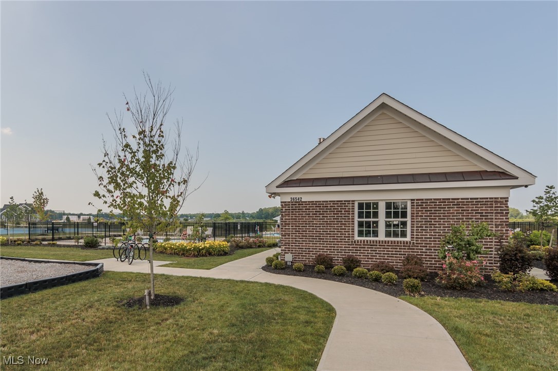 36458 Appian Way North Ridgeville, OH 44039 - Photo 36 of 37 View of community featuring a lawn