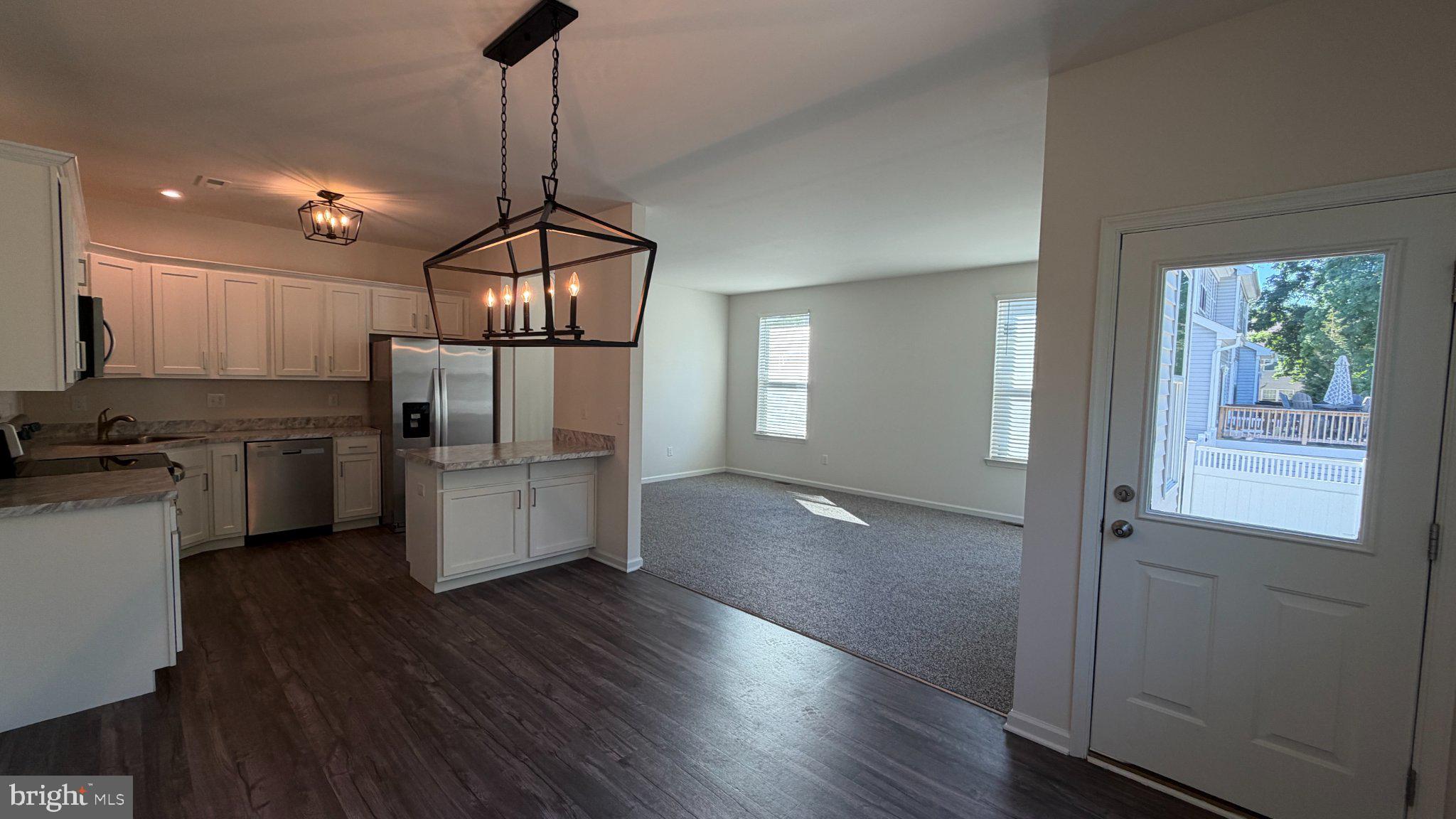 78 Tansboro Road Berlin, NJ 08009 - Photo 4 of 41 a kitchen with kitchen island white cabinets and stainless steel appliances