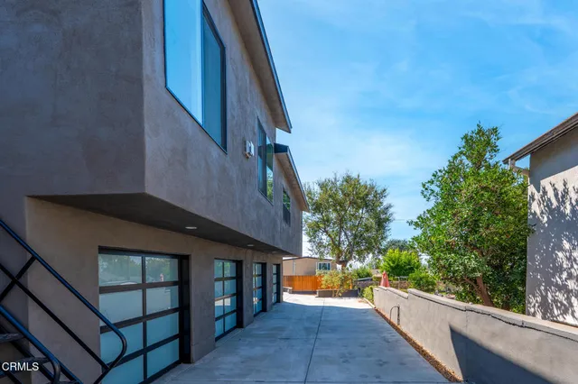 a view of backyard with patio