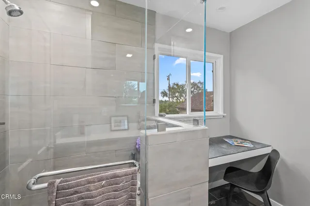 a bathroom with a shower and a sink