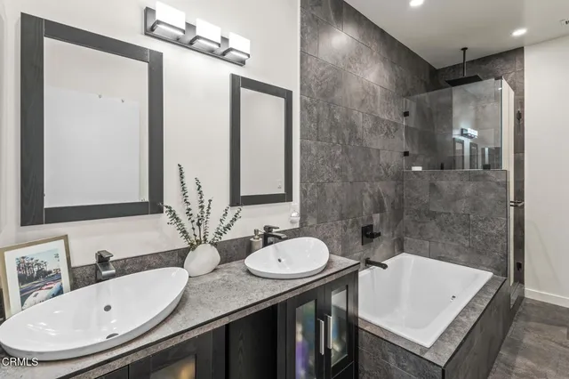 a kitchen with a appliances a refrigerator and a stove top oven