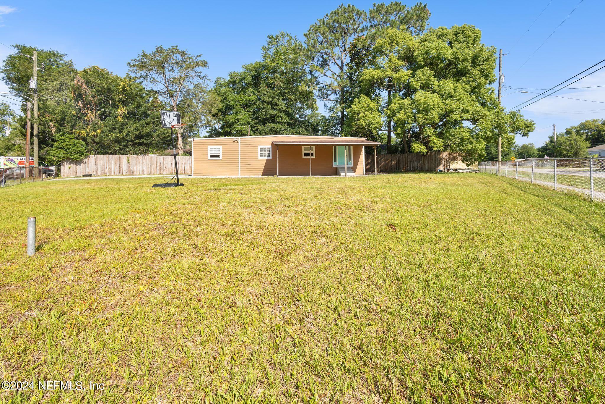 10357 Anson Road Jacksonville, FL 32246 - Photo 2 of 27 a view of a house with a yard
