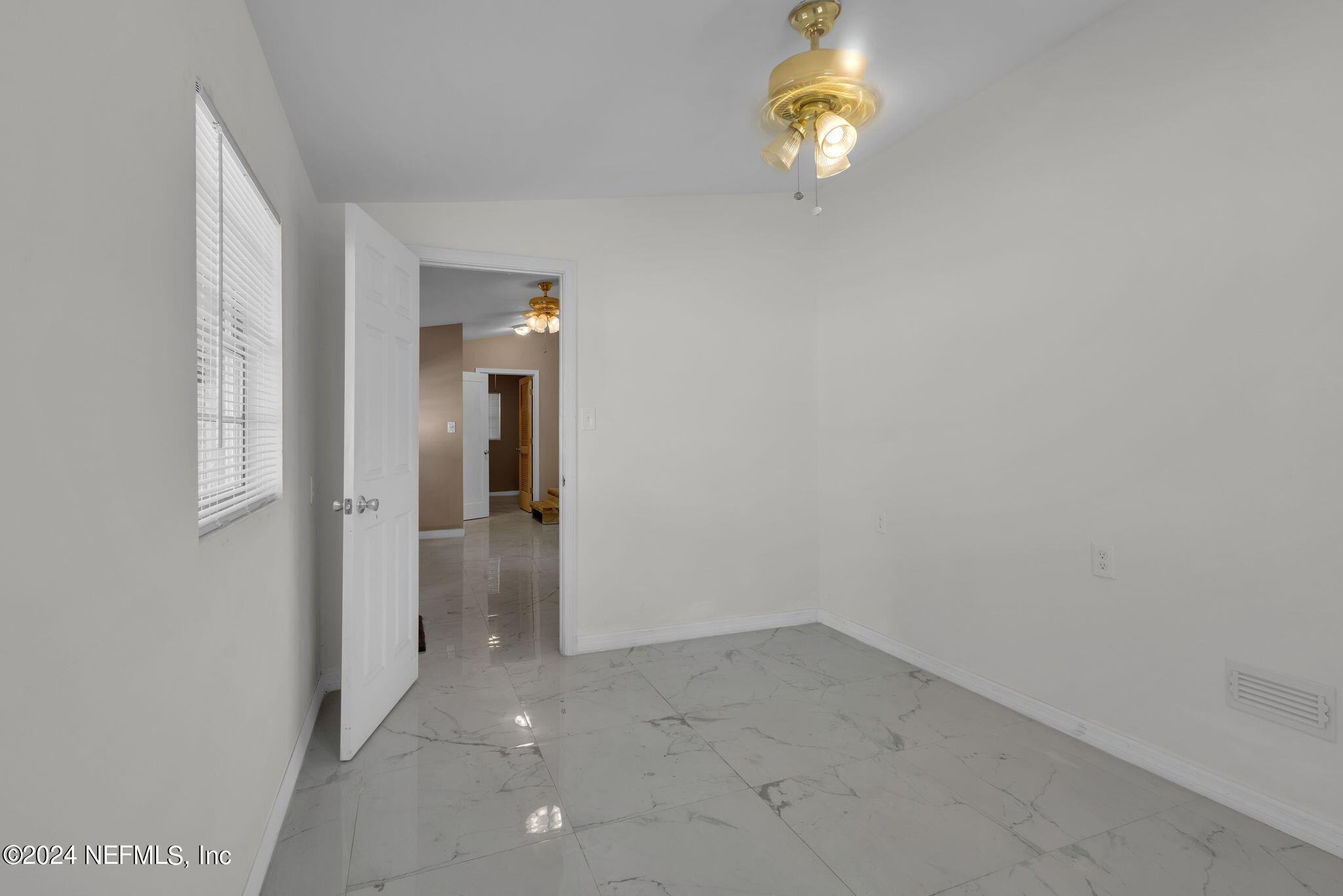 10357 Anson Road Jacksonville, FL 32246 - Photo 26 of 27 wooden floor in an empty room
