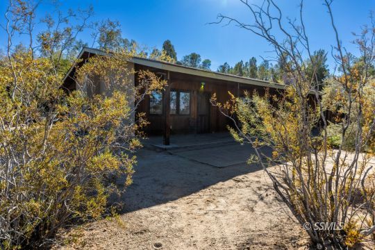 1029 Leslie Street Ridgecrest, CA 93555 - Photo 31 of 40 a view of a house with a yard