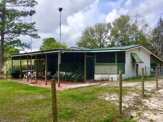 1401 Martin Road DeFuniak Springs, FL 32433 - Photo 4 of 51 Back of House w/ Patio & Screen Porch